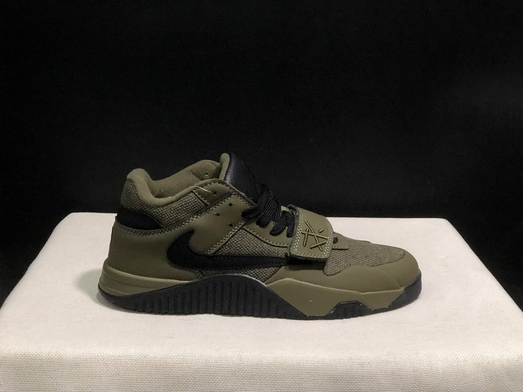Outer side profile of a single olive and black sneaker showing its layered upper and black outsole.