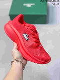 Red Lacoste Neo Run low-top sneaker with a lace-up front, perforated-looking upper, and sculpted red sole; size range text 36–45 is visible.