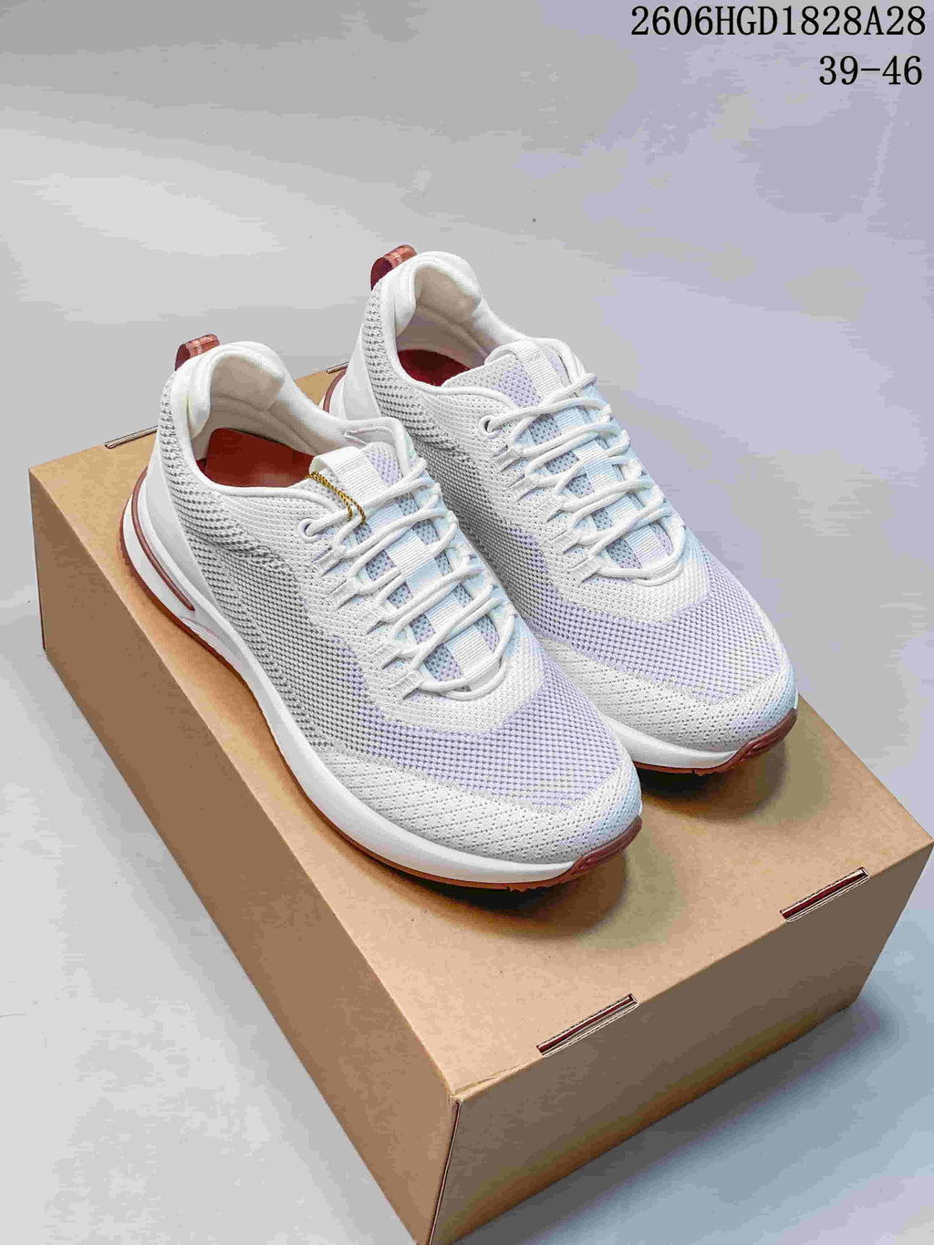 White and pale lavender Loro Piana Week End Walk sneakers with dusty-rose outsole accents, shown from above.