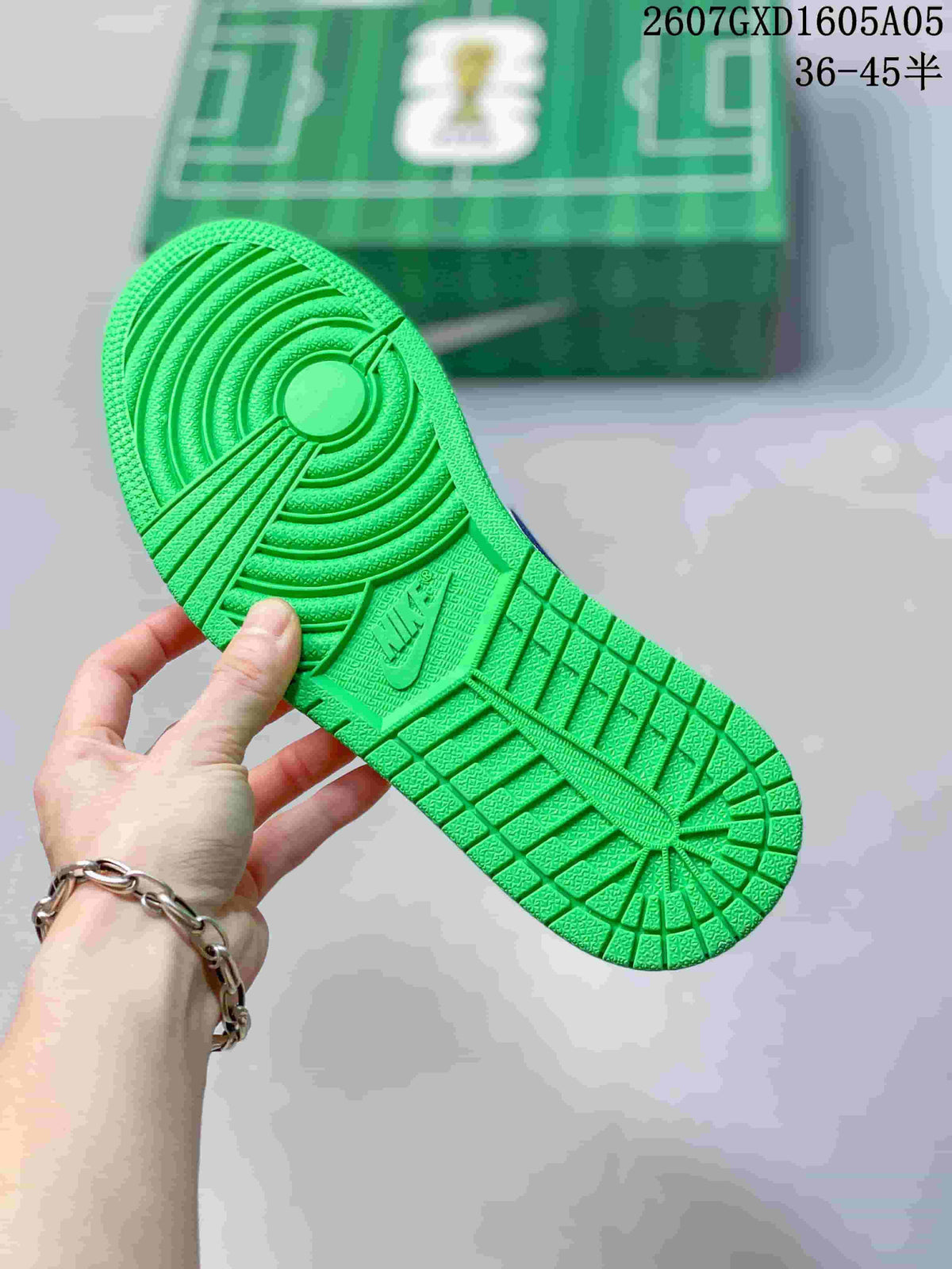 Close view of the bright green outsole showing its circular and geometric tread pattern.