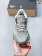 Top view of the sneaker showing the laces, tongue branding, padded collar and perforated-looking forefoot pattern.
