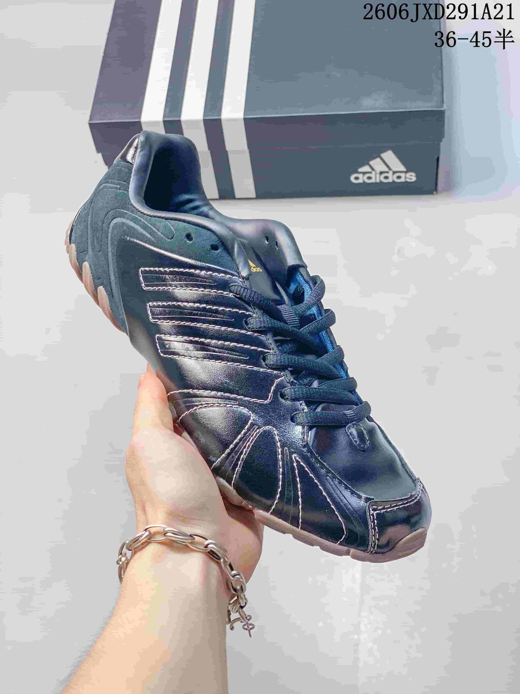 Angled close view of the dark navy Ghost Sprint sneaker with contrasting stitched panels.