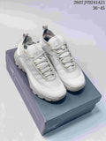 Pair of light gray Arc'teryx Norvan LD 3 trail sneakers displayed on a shoebox.