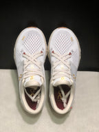 Top-down view of the white On Cloud X4 pair showing the lace-up closure and perforated toe panels.