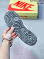 Close view of the sneaker outsole showing concentric circular traction patterns and a textured perimeter.