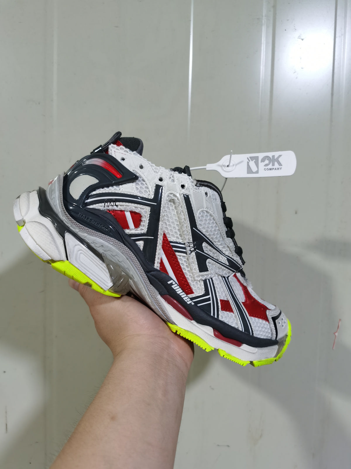 Angled view of the Balenciaga Runner sneaker showing the sculpted heel, contrasting laces and multicolor panel construction.