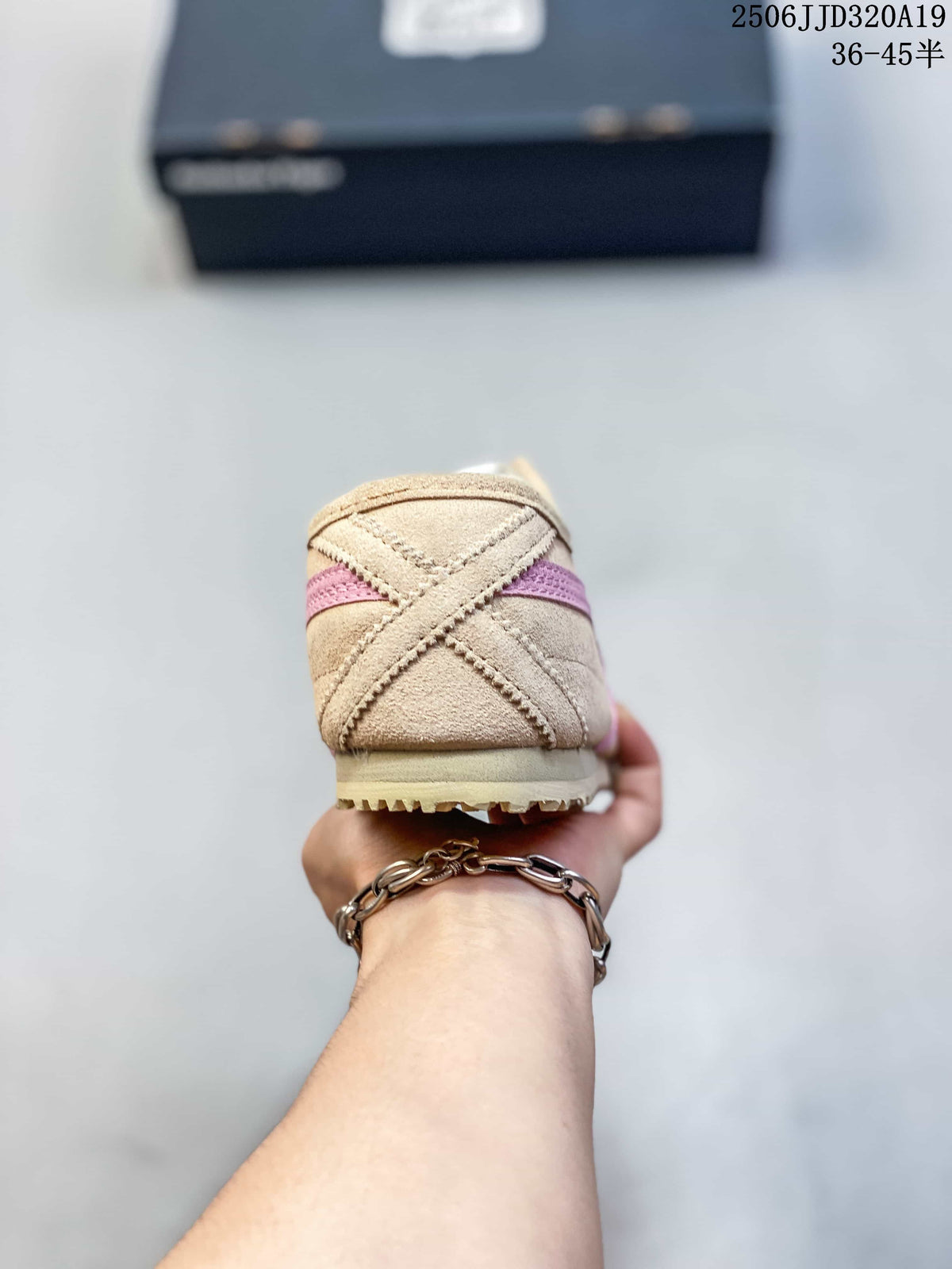 Rear view showing the beige heel panel, pink stripe, and outsole edge.