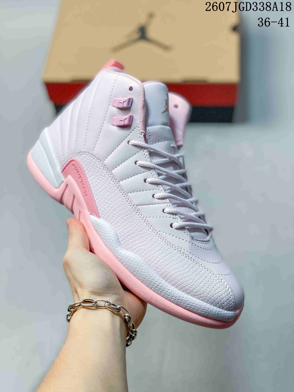 Close side view of a white and pink high-top sneaker with textured side detailing, lace-up closure and padded collar; overlay text shows size range 36–41.