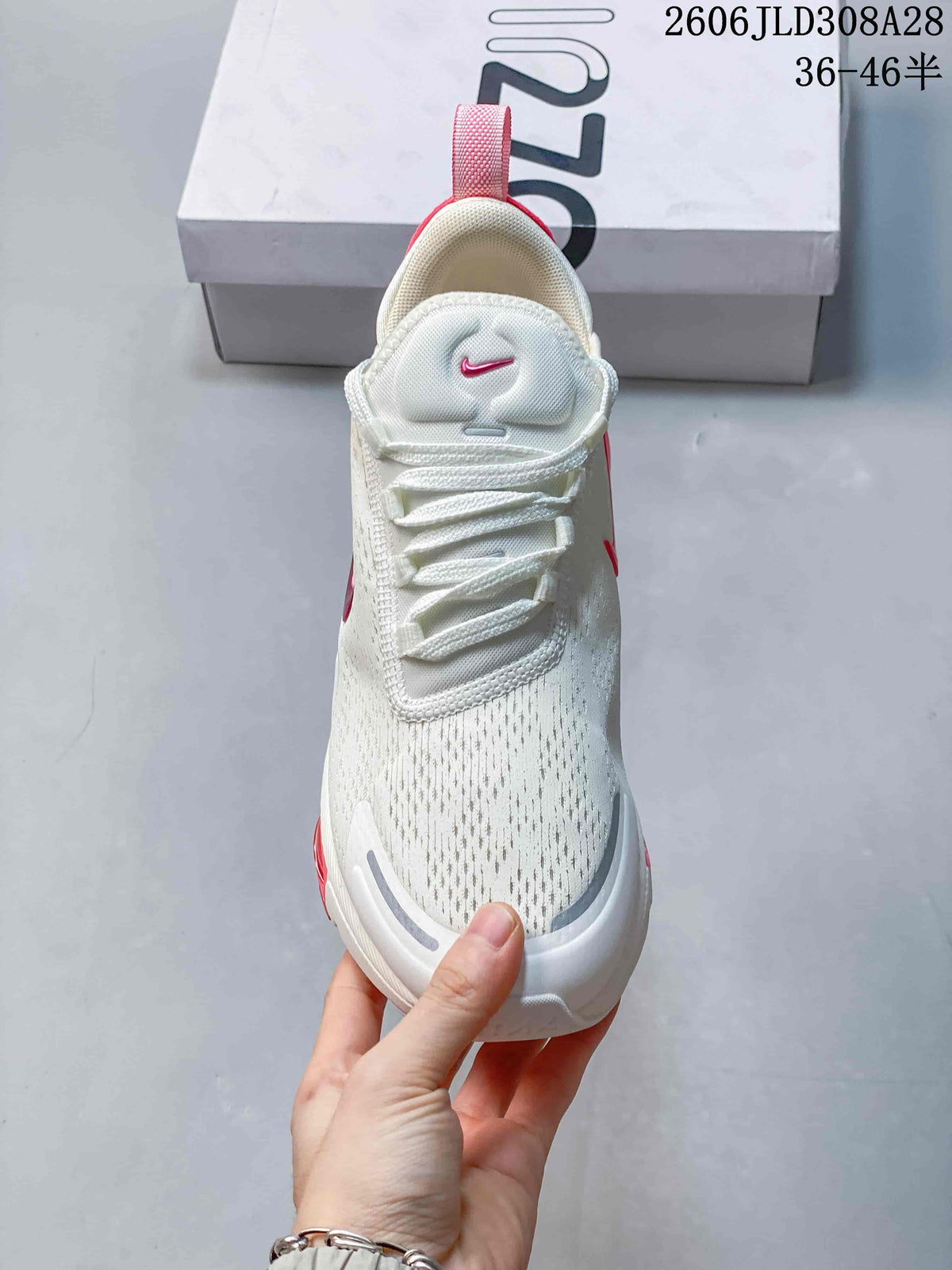 Front view showing the laces and patterned upper of a Nike Air Max 270 Premium sneaker
