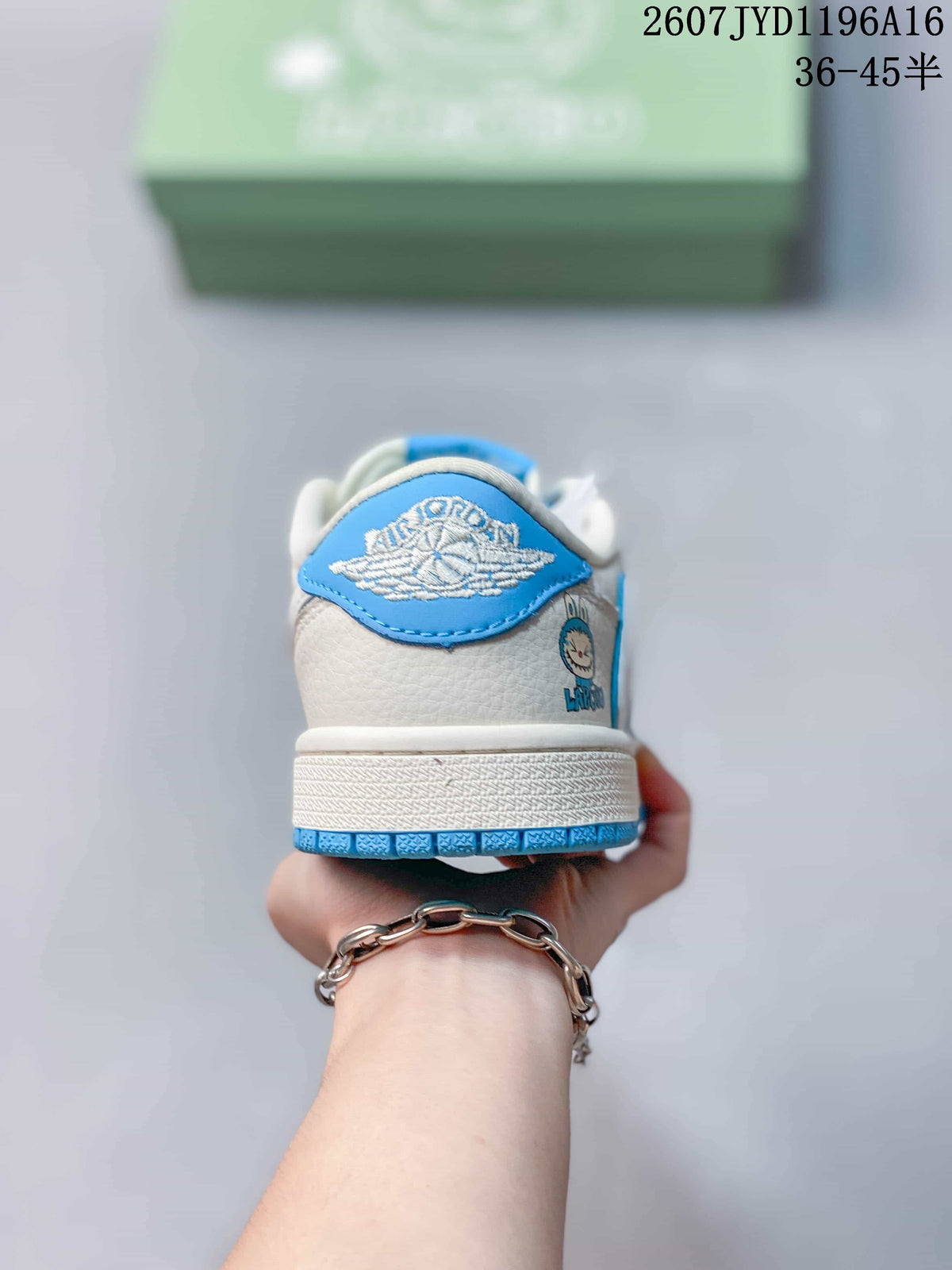 Rear view of the sneaker showing a blue Jordan wing detail, white heel panel, and blue outsole edge.