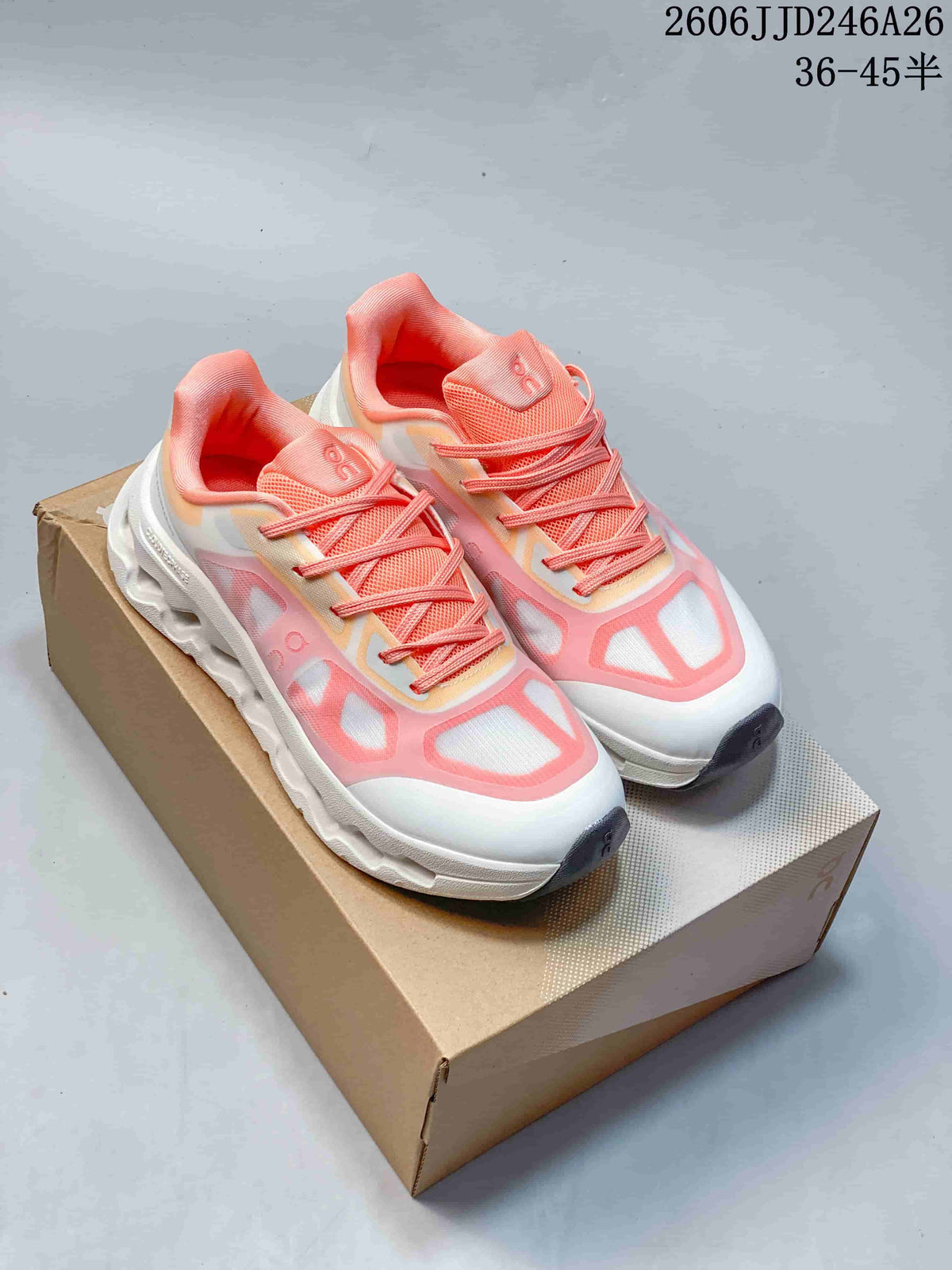 Pair of white and pink On Cloudtilt Remix sneakers displayed on a shoebox.