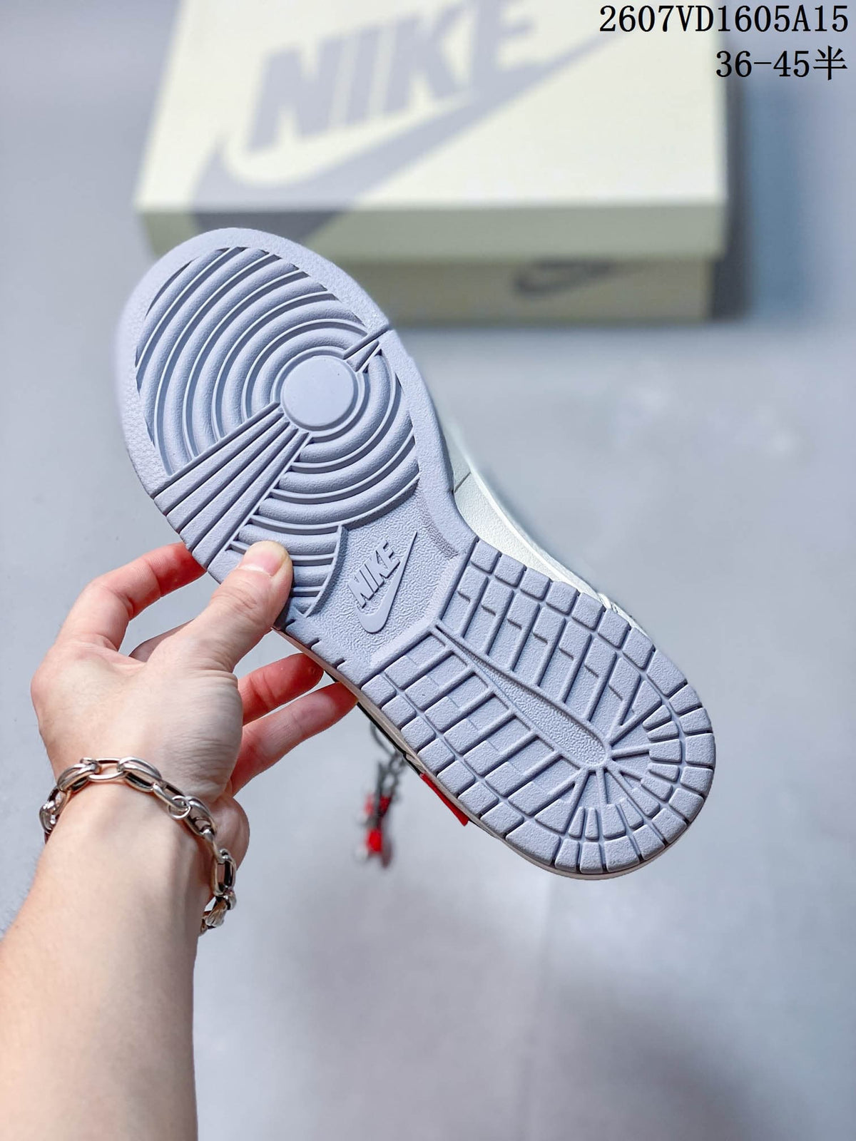 Underside view showing the gray patterned outsole and Nike branding.