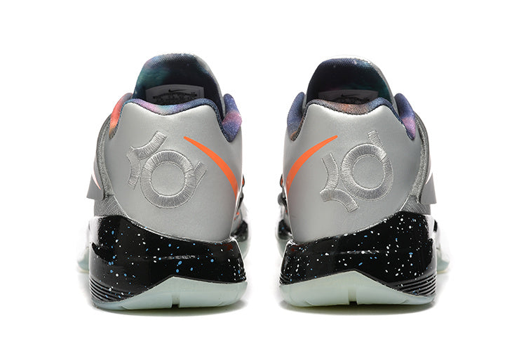 Rear view of silver-gray Nike KD 4 shoes with orange accents and black speckled midsoles.
