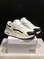Pair of white and black Off-White low-top sneakers displayed on a shoebox; the box label shows size 41.