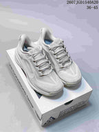 Pair of light white and grey Nike ACG Pegasus Trail low-top sneakers displayed on a shoebox.