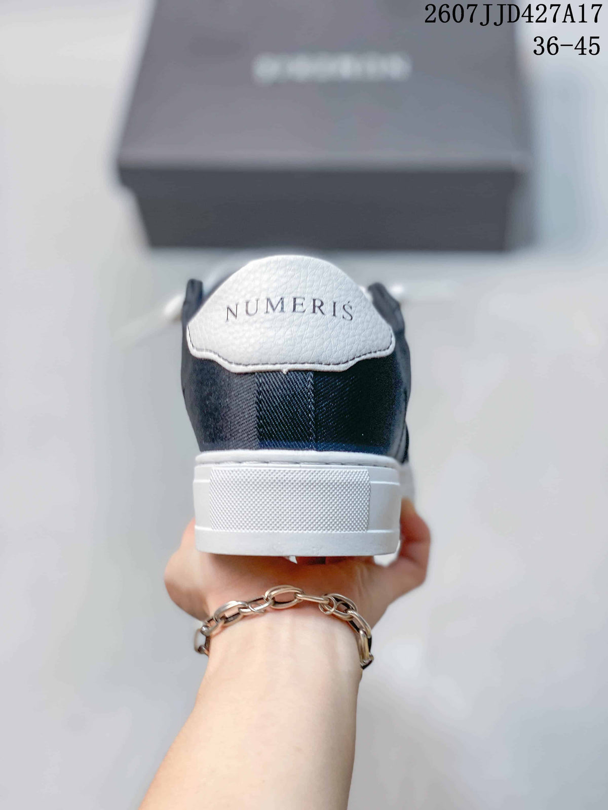 Rear view of the navy and white sneaker showing the NUMERIS heel branding and white heel panel.