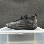 Charcoal gray low-top basketball shoe with a tonal sculpted sole