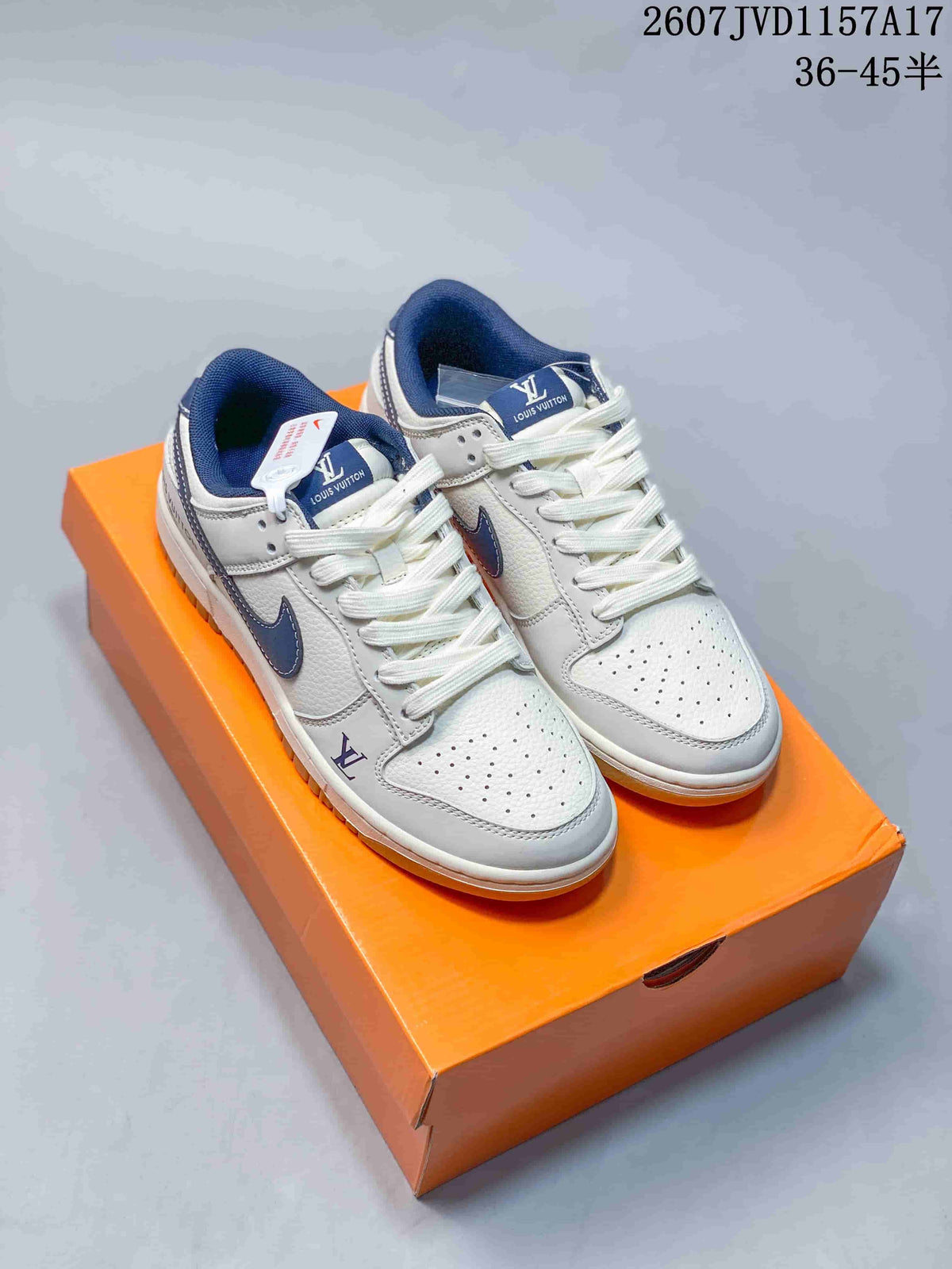 Pair of white and navy Louis Vuitton x Nike Dunk Low sneakers displayed on an orange shoebox; style code 2607JVD1157A17 and size range 36–45 are visible.