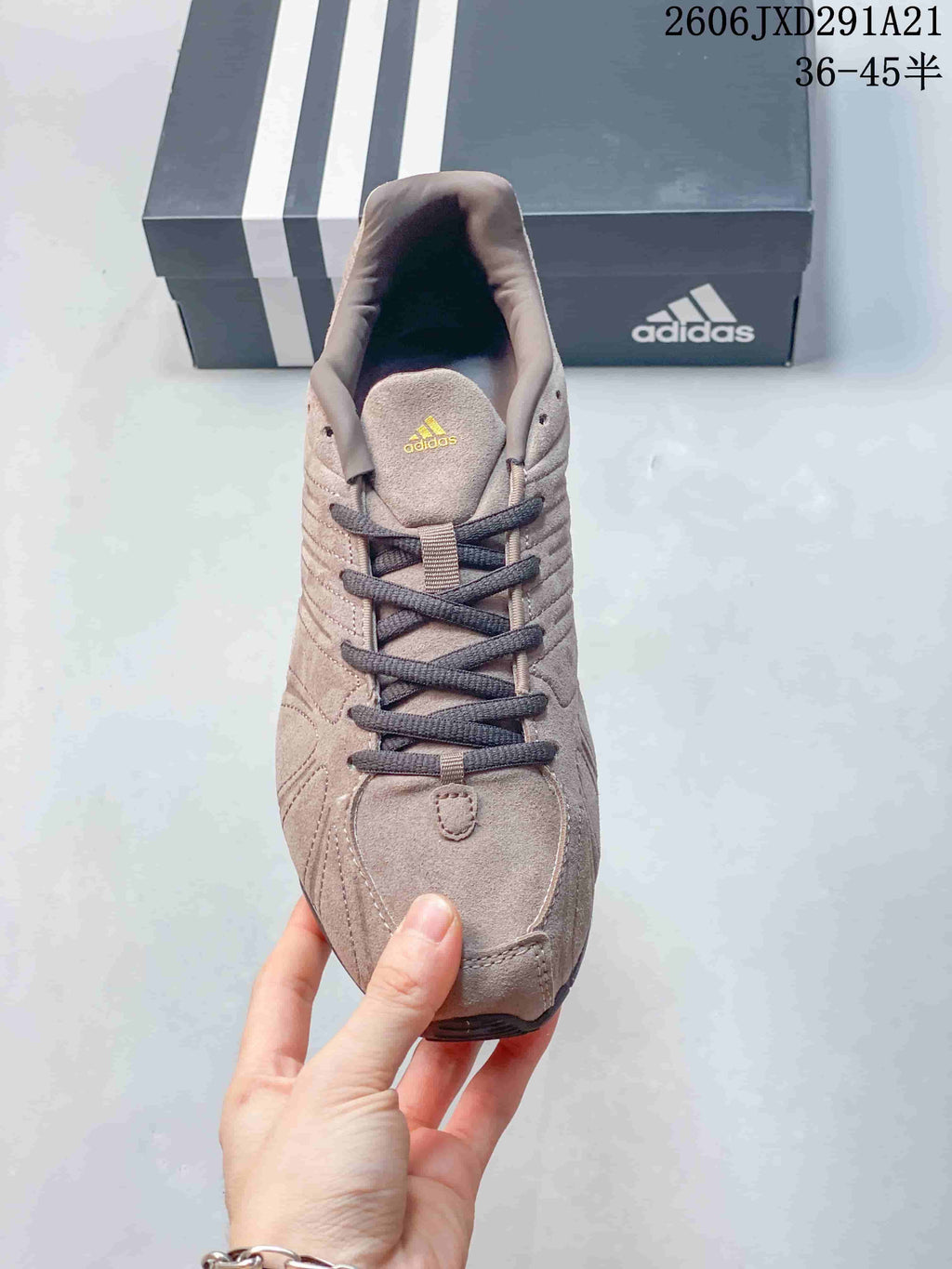 Top view showing the dark laces, tongue branding and rounded toe shape.