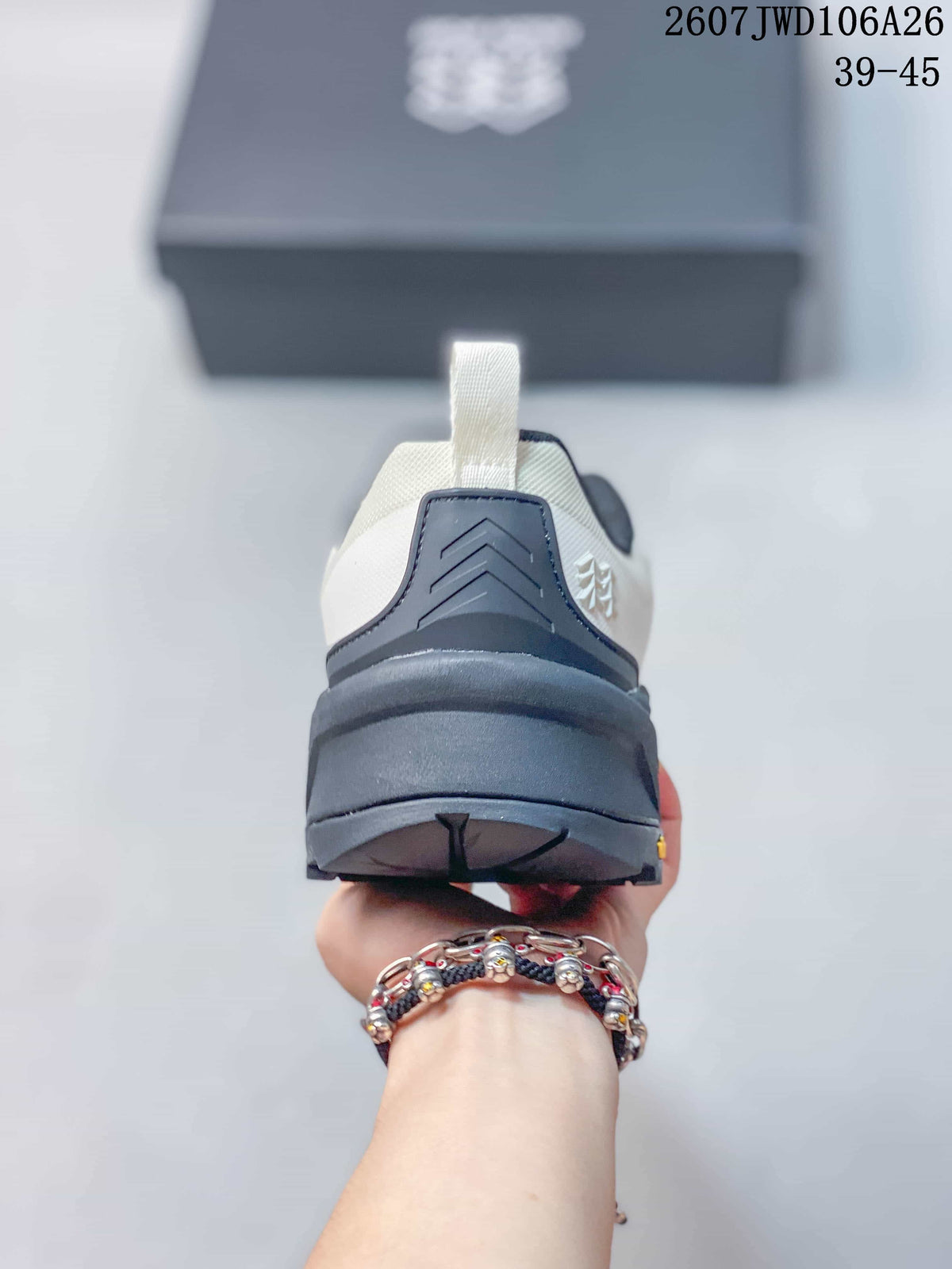 Rear view of the hiking shoe showing the padded heel collar, pull tab and layered black outsole.
