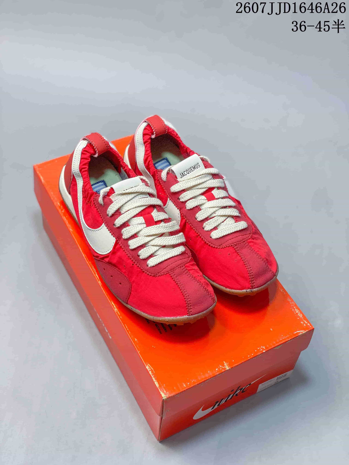 Pair of red and white low-top sneakers displayed on an orange Nike shoebox, with JJD1646A26 and a 36–45.5 size range visible in the image text.