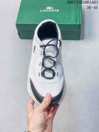Top view showing the dotted upper, navy loop-style lace guides, and toe detail