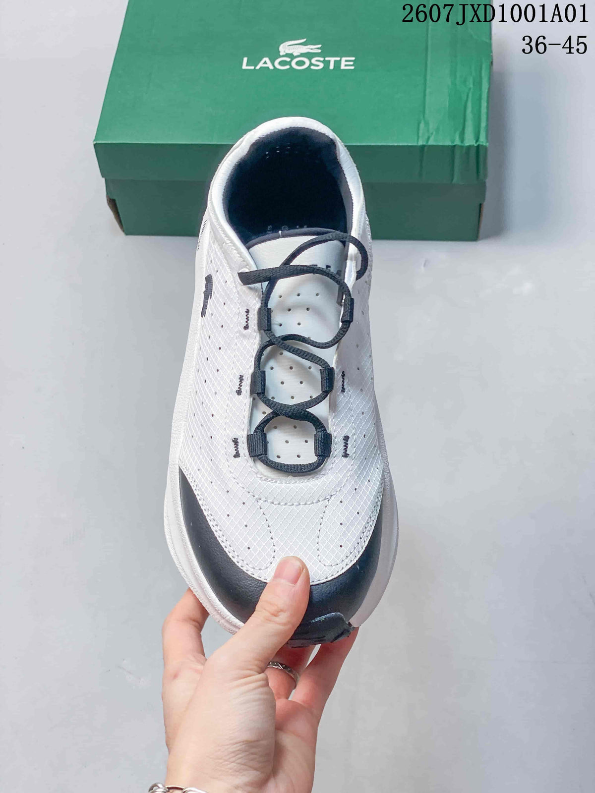 Top view showing the dotted upper, navy loop-style lace guides, and toe detail