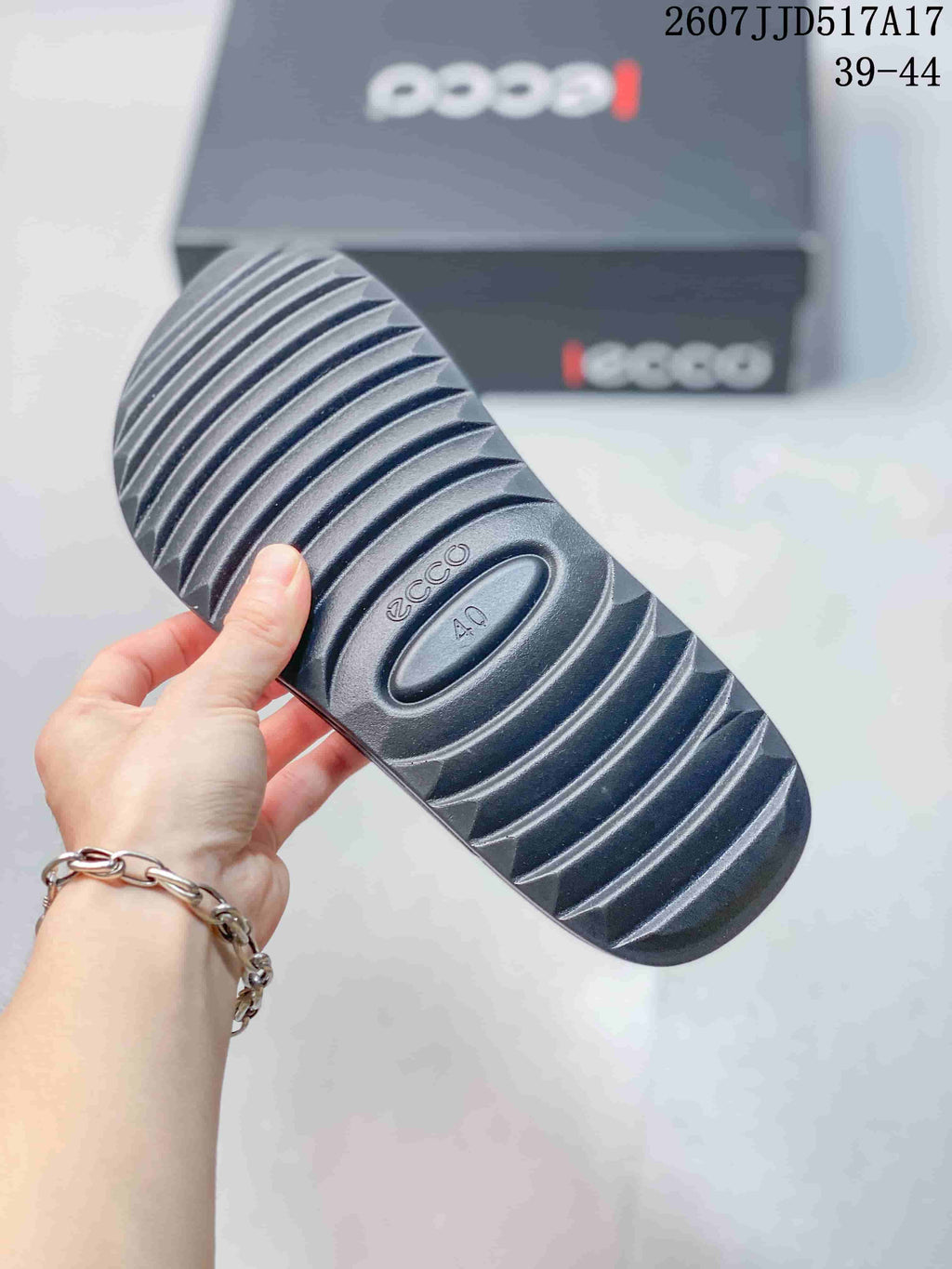 Close-up of the sandal outsole showing ECCO branding, a visible size 40 marking, and raised diagonal tread.