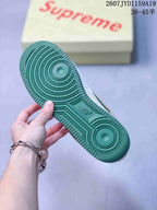 Close-up of the green rubber outsole with concentric traction circles and Air branding.
