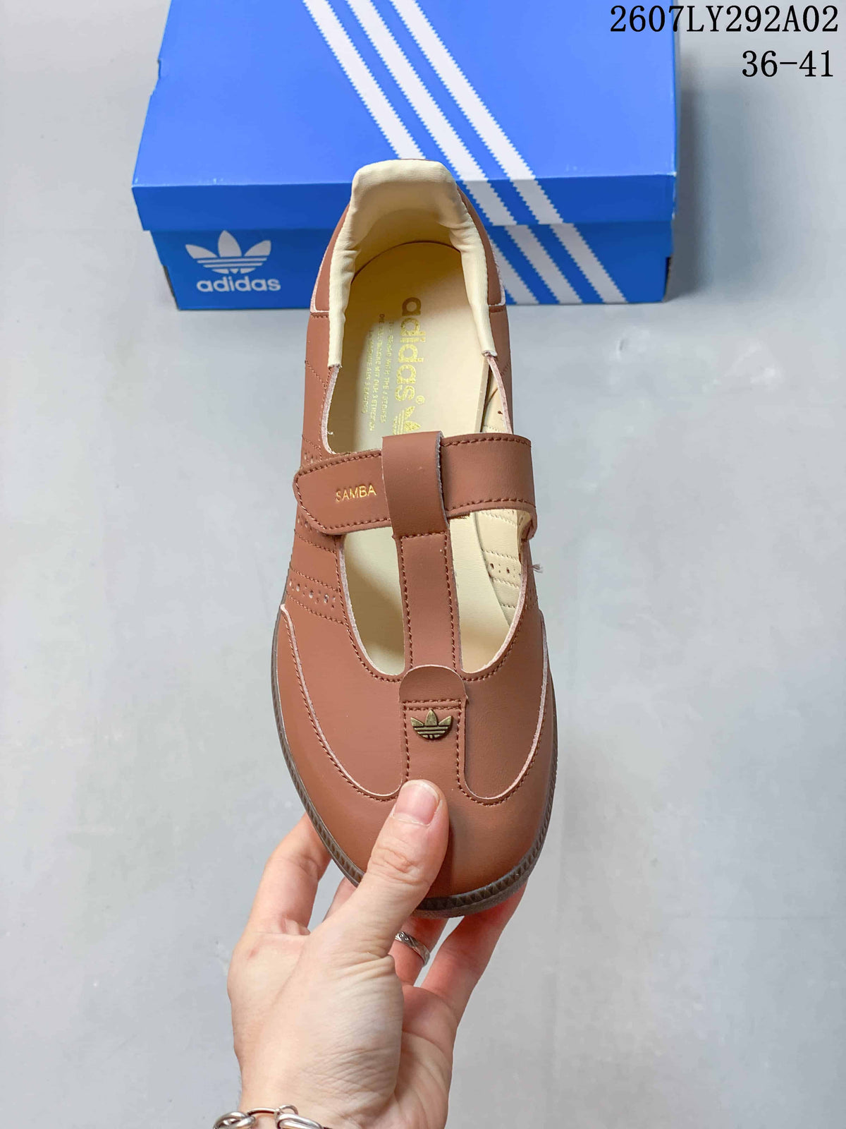 Top view of the brown Mary Jane-style sneaker showing the cross strap, Samba branding, cream lining, and trefoil detail.
