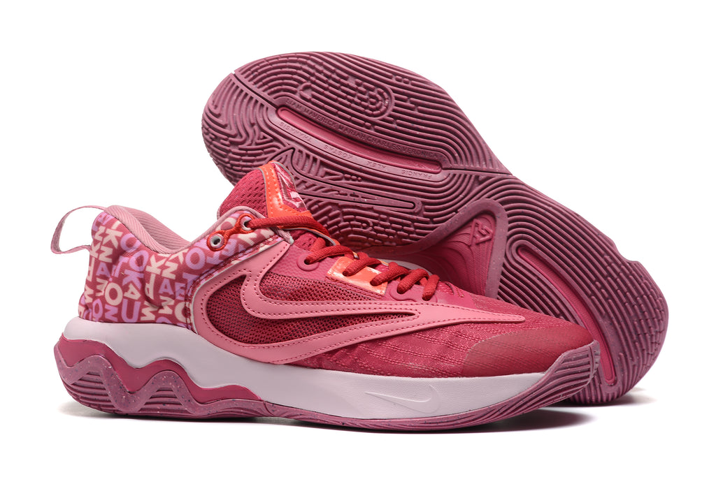 Pink basketball shoe with contrasting pink and cream details