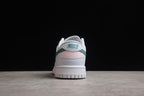 Rear view showing the white heel, green and pink accent bands, and Nike branding.