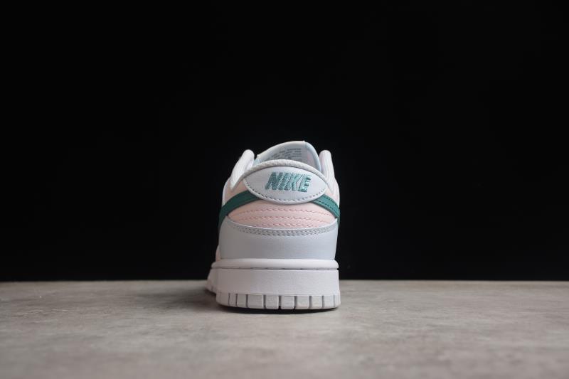 Rear view showing the white heel, green and pink accent bands, and Nike branding.