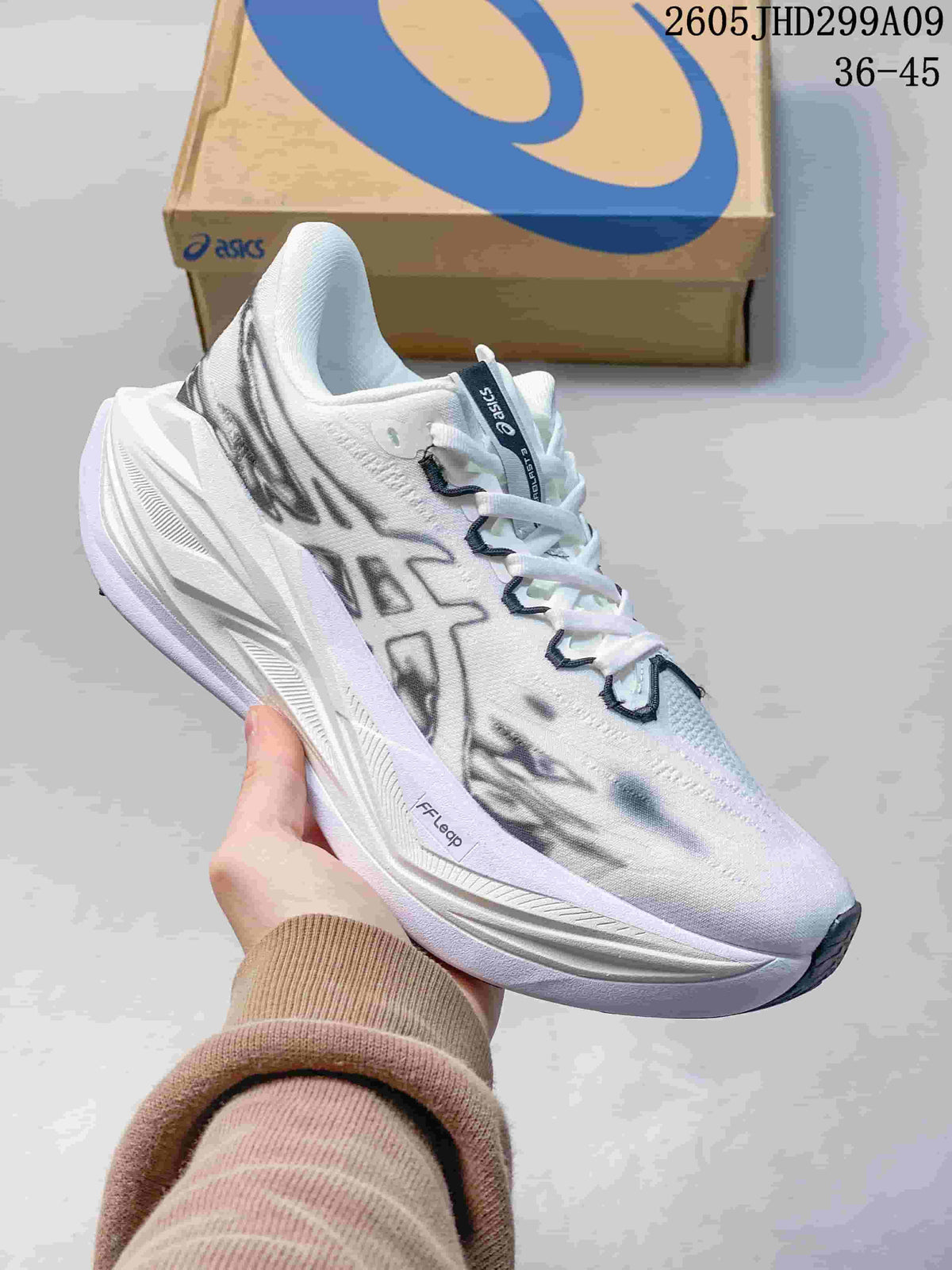 White ASICS Superblast 3 running shoe with dark patterned side graphics