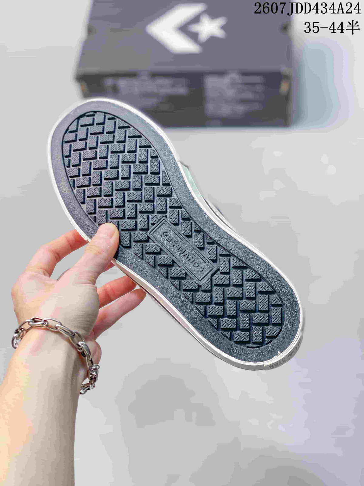 Close view of the sneaker outsole showing a repeating geometric tread pattern and a central molded panel.