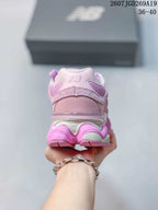 Rear view highlighting the padded heel collar, layered heel construction, and chunky outsole.