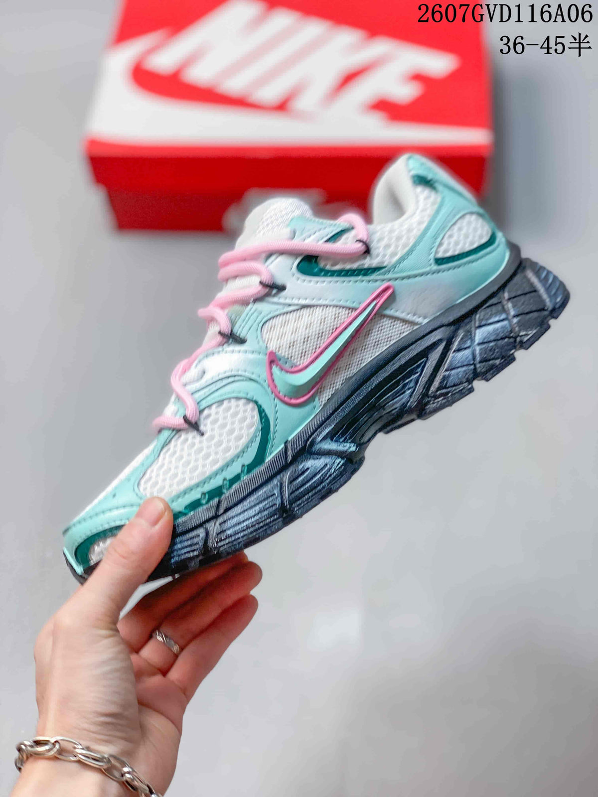 Side profile of the Nike V5 RNR sneaker showing mint and white upper panels, pink laces, Nike side branding and a dark textured sole.