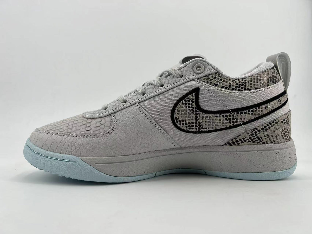 Side profile showing the patterned Swoosh and gray upper