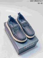 Dark navy ECCO slip-on shoes with mesh panels displayed on an ECCO shoebox; image text shows style code 2607 JWD847A17 and size range 38–45.