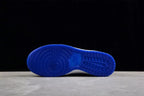 Blue rubber outsole shown from below with circular and grid traction patterns.