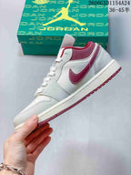 Side view of an off-white and gray Air Jordan 1 Low with burgundy accents