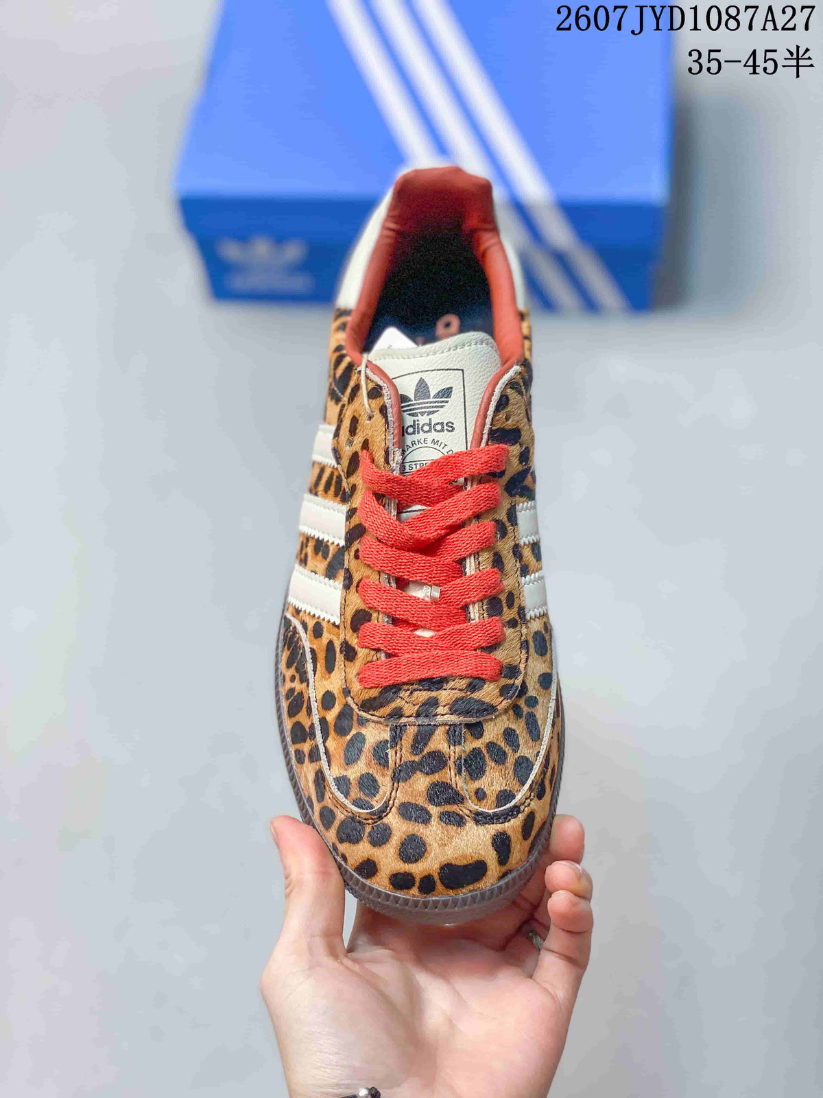 Top view showing the leopard-print toe box, red laces, white tongue, and adidas branding.