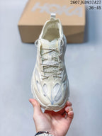 Top view showing the rounded toe, patterned tongue area, contrast laces, and layered upper.