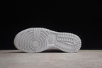 Underside view showing the white rubber outsole and patterned tread.