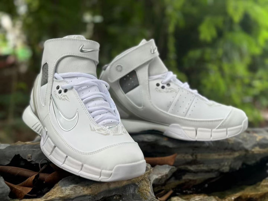 Angled view of the pair showing the high-top shape and white finish