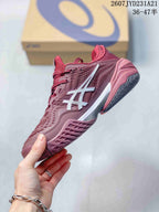 Side and outsole view of the burgundy tennis shoe showing the white ASICS side logo and textured sole pattern.
