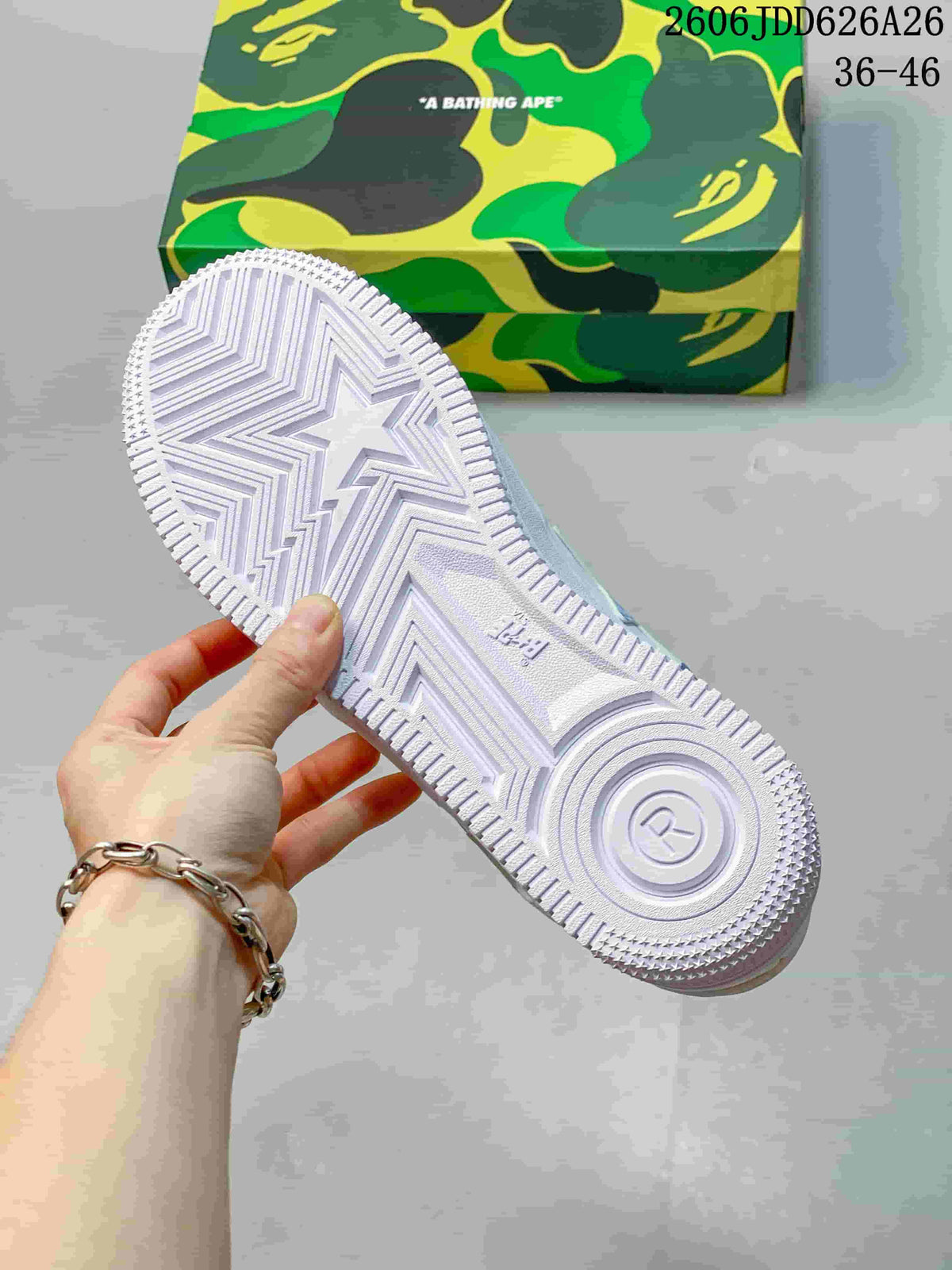Outsole view showing the textured white rubber tread and star-shaped traction pattern.
