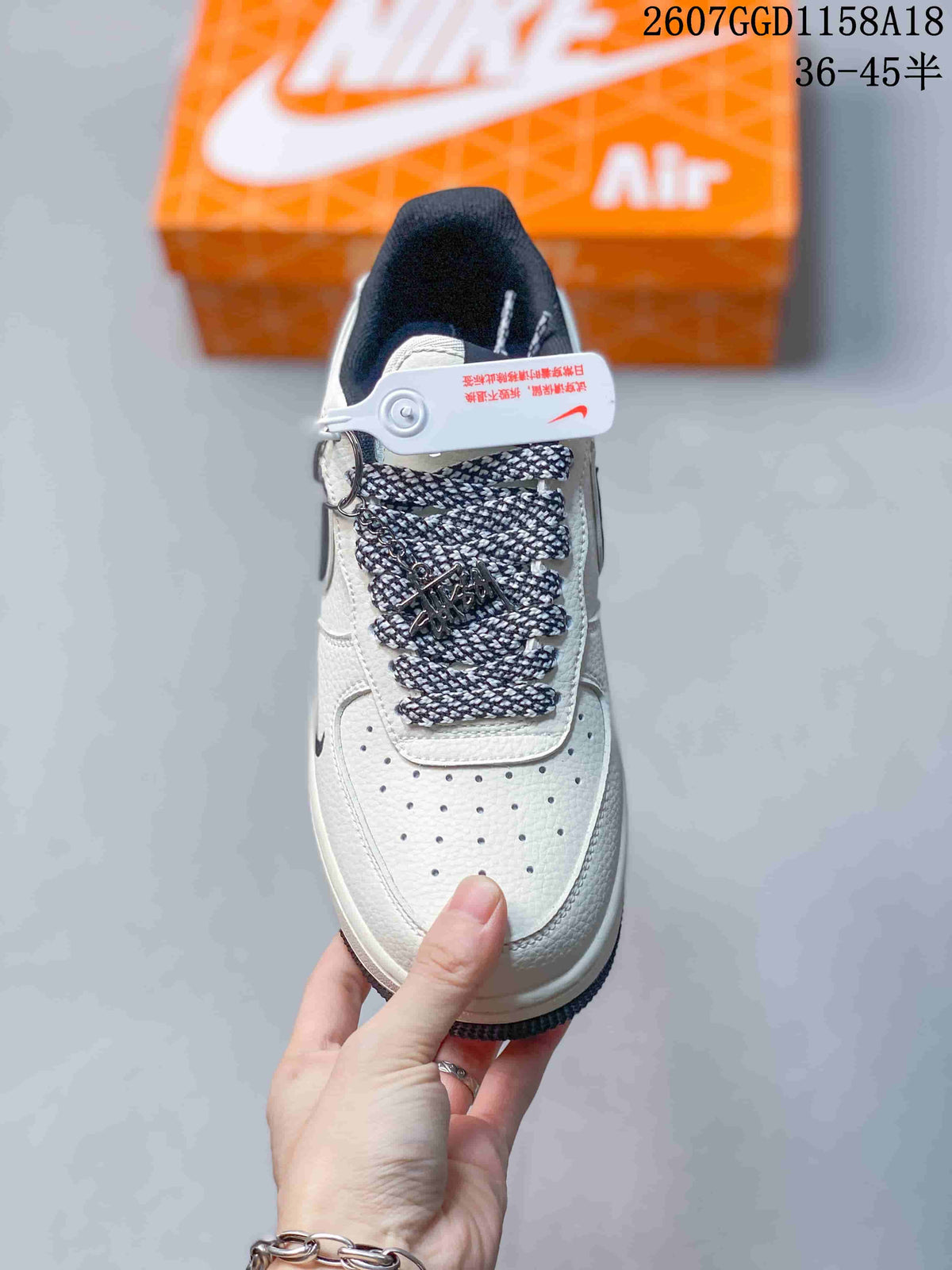 Top view of the sneaker showing the perforated toe box, patterned laces, and tongue area.