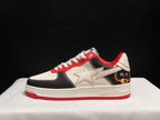 Side profile showing the white star-shaped side detail, black and white panels, red collar, and red outsole.