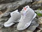 Angled view highlighting the laces, tongue emblem, and textured overlays